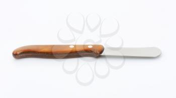 Table knife with rounded point used to serve and spread butter