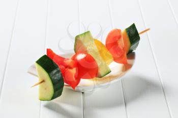 Pieces of fresh vegetables on wooden skewer