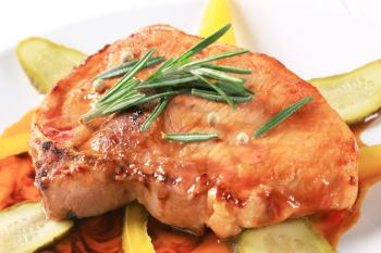 Glazed pork chop with pickles and yellow pepper