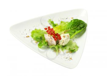 Savory spreads on lettuce leaves sprinkled with pine nuts