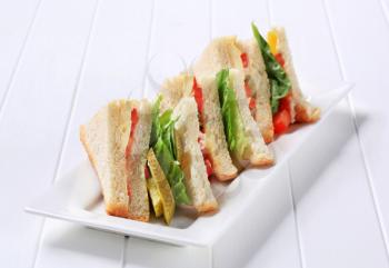 Vegetable double decker sandwiches on long plate