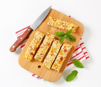 Cereal bars with pieces of dried apricot and apple