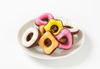 Fondant candies half coated in chocolate