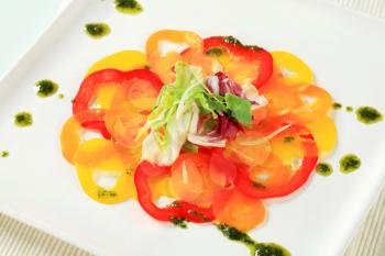 Thinly sliced bell peppers with pesto