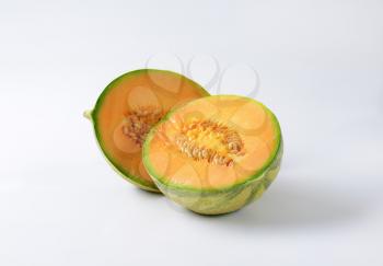 Halves of fresh orange-fleshed melon