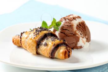 Chocolate chip croissant and scoop of vanilla chocolate ice cream