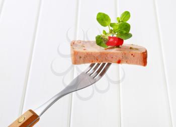 Slice of spicy meatloaf on fork