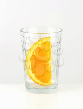 Orange wedge in empty glass