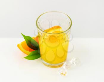 Glass of orange juice with ice