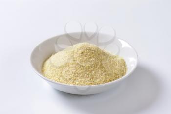 Pile of finely ground bread crumbs on plate