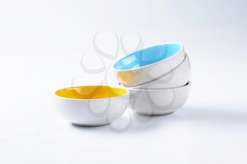 Set of empty round two tone bowls