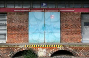 Exterior of old brick warehouse with loading dock