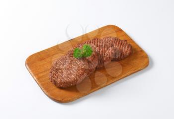 Grilled Beef Burger Patties on cutting board