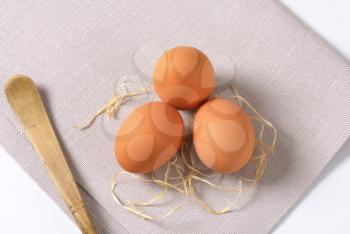 eggs with straw  on place mat