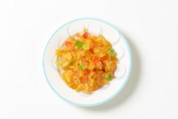 plate of candied fruit on white background