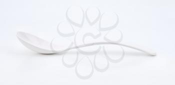 Plain white spoon with deep cup