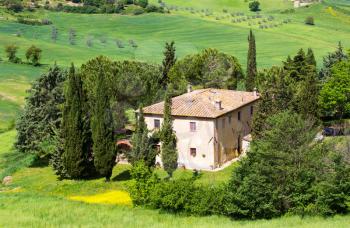 Tuscan rural landscape with villa near Volterra in Italy