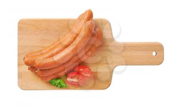 stack of long thin sausages on cutting board