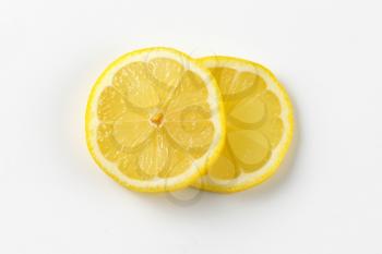 two thin slices of fresh lemon