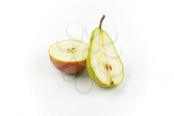 two halves of ripe pear on white background