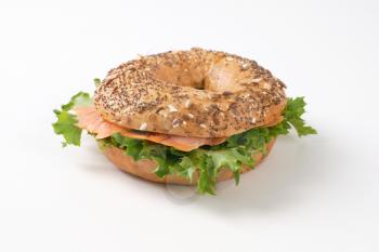 bagel sandwich with smoked salmon on white background