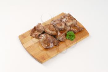 pan fried chicken liver on wooden cutting board