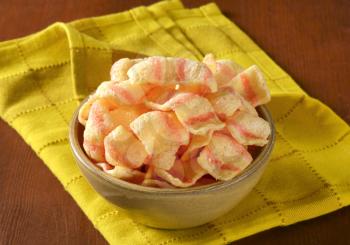 Bowl of bacon-flavored puffed wheat chips