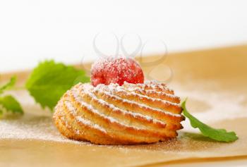 Traditional Sicilian almond cookie topped with glace cherry
