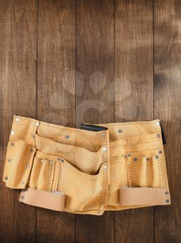 tool belt on wooden background