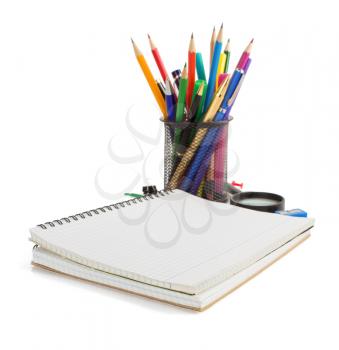 notebook and school supplies isolated on white background