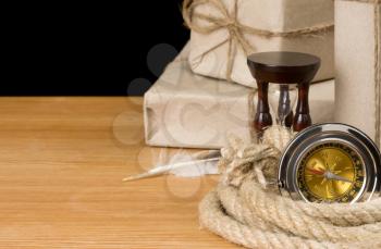 parcel wrapped and compass isolated on black background