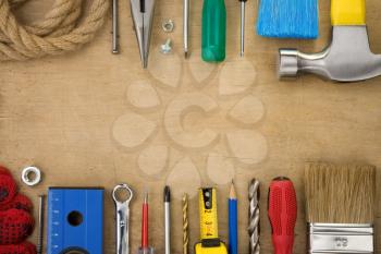 set of tools on wood texture background