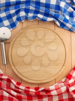 napkin and cutting board on wooden background