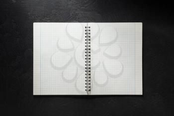 notebook on black background texture