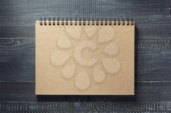 notebook at wooden  background texture