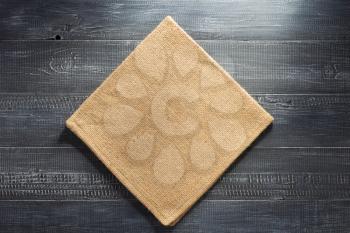 burlap hessian napkin on wooden background