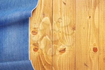 jeans texture on old wooden background, table surface