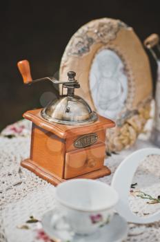 Little table with flowers and beautiful things in a garden.