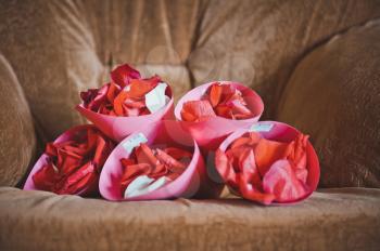 Rolls from paper with petals of roses.
