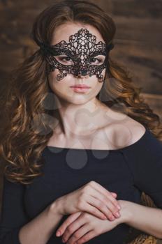 Girl in a black mask.
