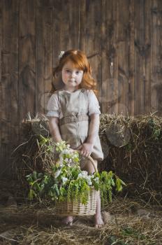The girl with red hair with a basket.