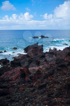 Easter Island rocky coast. The waves of the Pacific Ocean