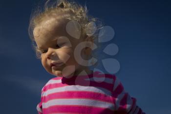 little girl walking by the sea. summer vacation by the ocean