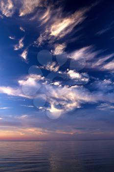 sunset on the sea. red and orange sun and blue water