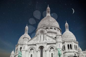 Montmartre Paris. Basilica of the Sacred Heart of Jesus. night shining moon and stars.