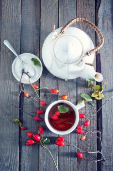 fresh tea with rosehip on a table