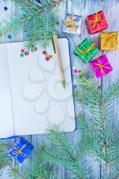 notepad and christmas decoration on a table