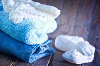 baby clothes for boy on the wooden table