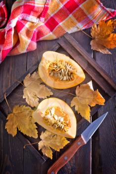 pumpkin porridge in the bowl and on a table