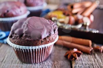 sweet chocolate muffins and aroma spice on a table